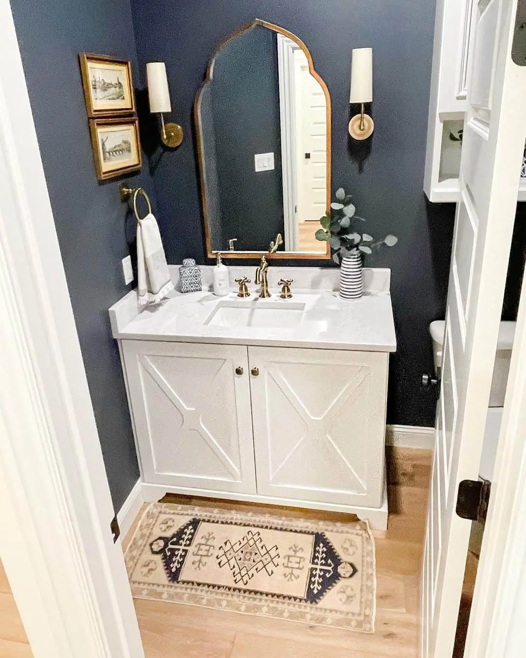 Stacked Landscape Art Adds Vintage Charm Above the Vanity