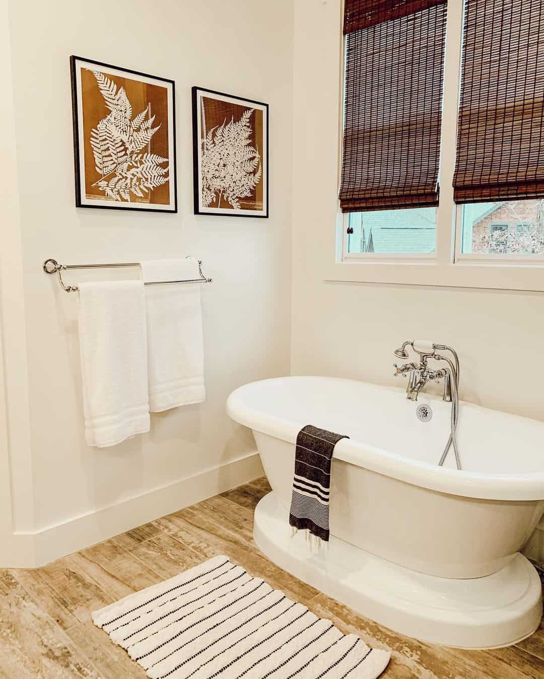 Two Framed Fern Prints Add Botanical Symmetry Above the Towel Bar
