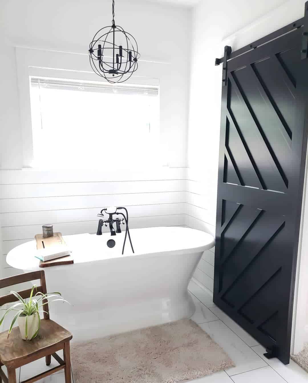 Geometric Barn Door Adds Bold Contrast to Shiplap Walls