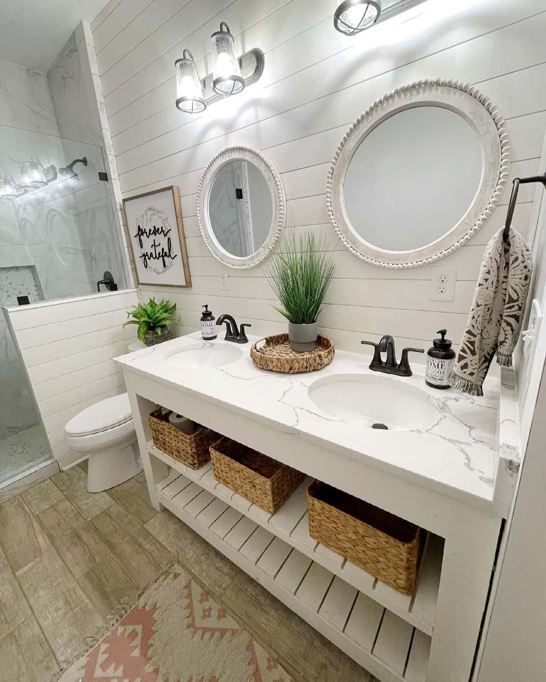 Two Oval Mirrors Add Symmetry Above Double Vanity