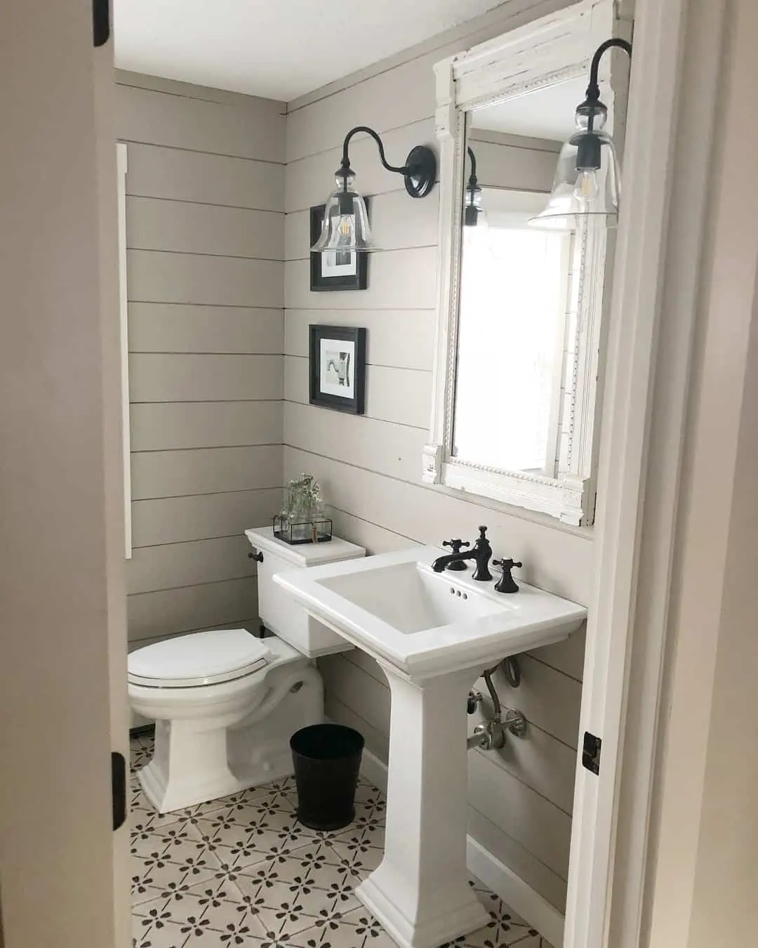 Black Fixtures Add Sharp Contrast to White Pedestal Sink