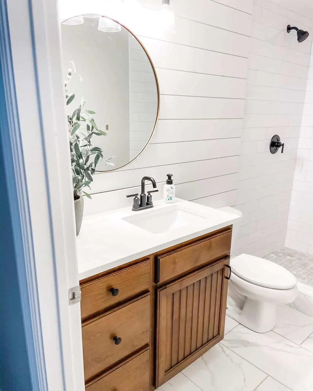 Circular Mirror Balances Shiplap and Wood Vanity