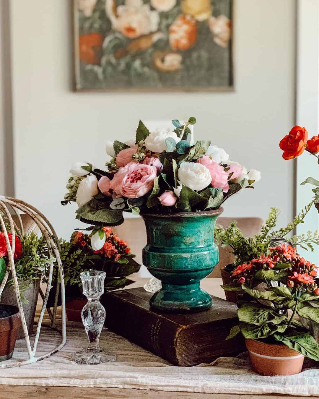 Distressed Teal Urn Vase Anchors A Floral Tablescape