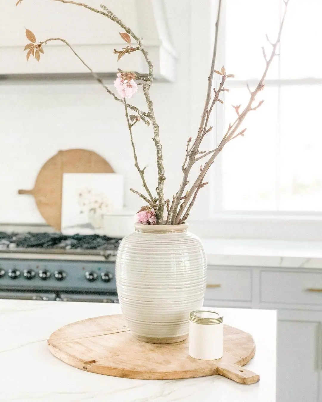 Ribbed Ceramic Vase Holds Delicate Spring Branches