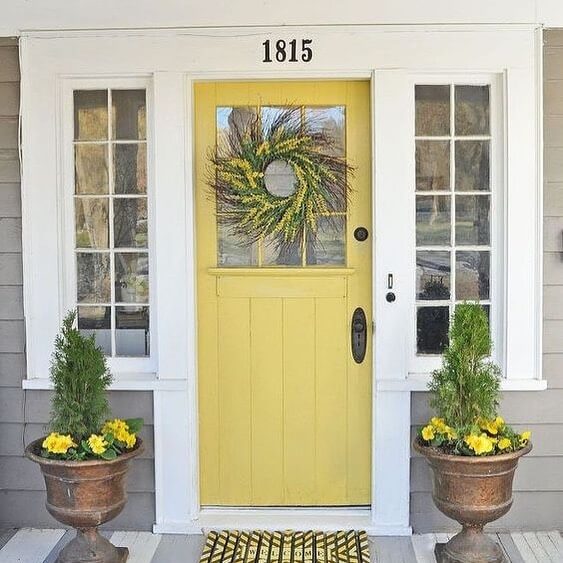 Sunny Yellow Door With a Natural Wheat Wreath