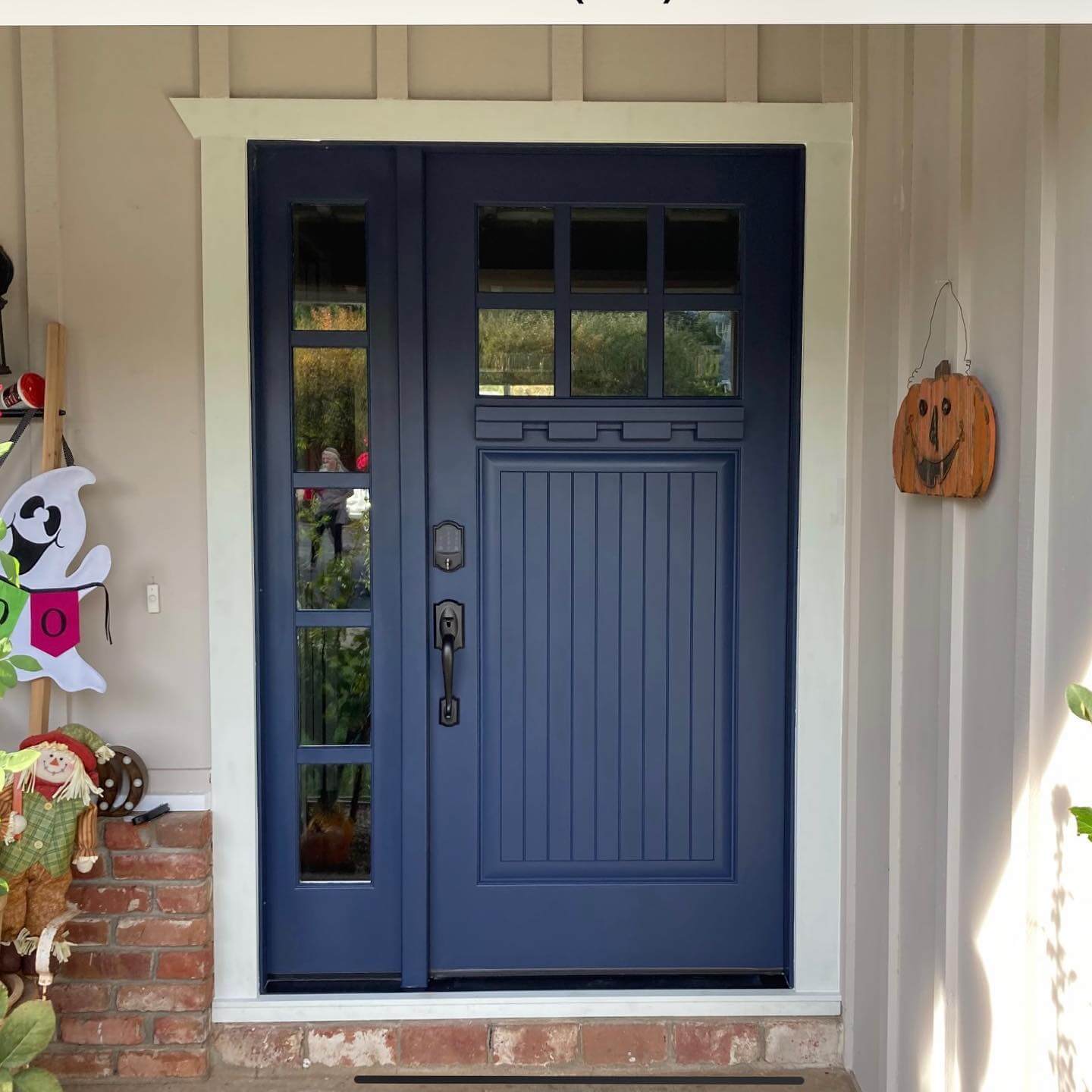 Deep Navy Door With Contrasting White Trim