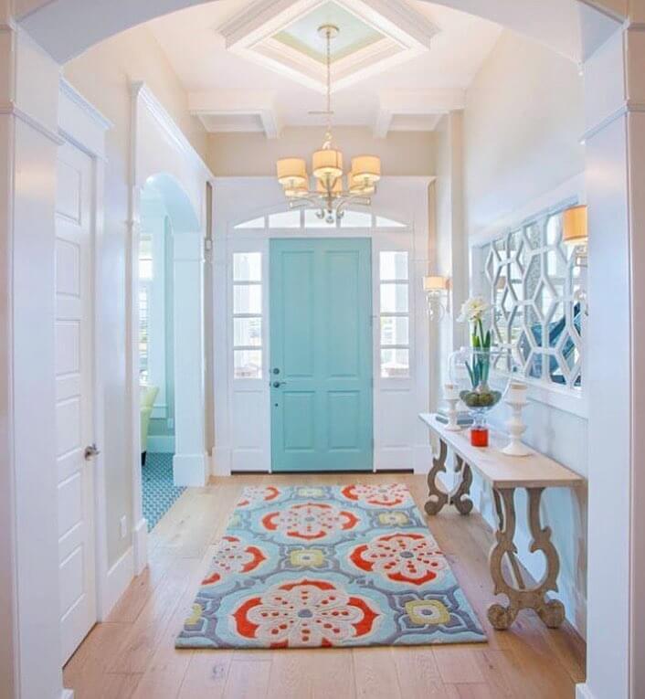 Bright Aqua Door With Geometric Mirror Wall Accent