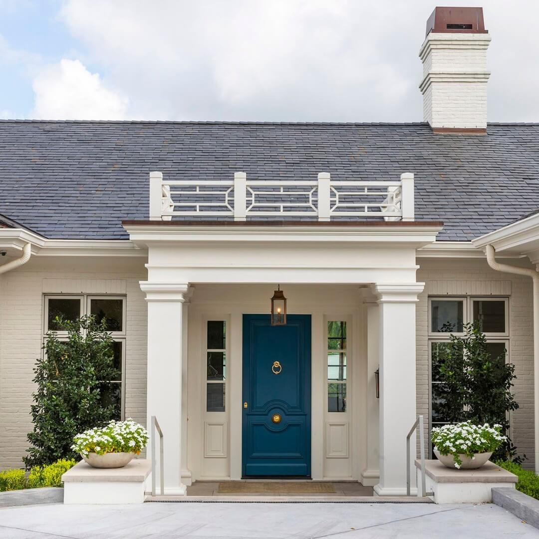 Deep Teal Door With Brass Hardware and White Planters