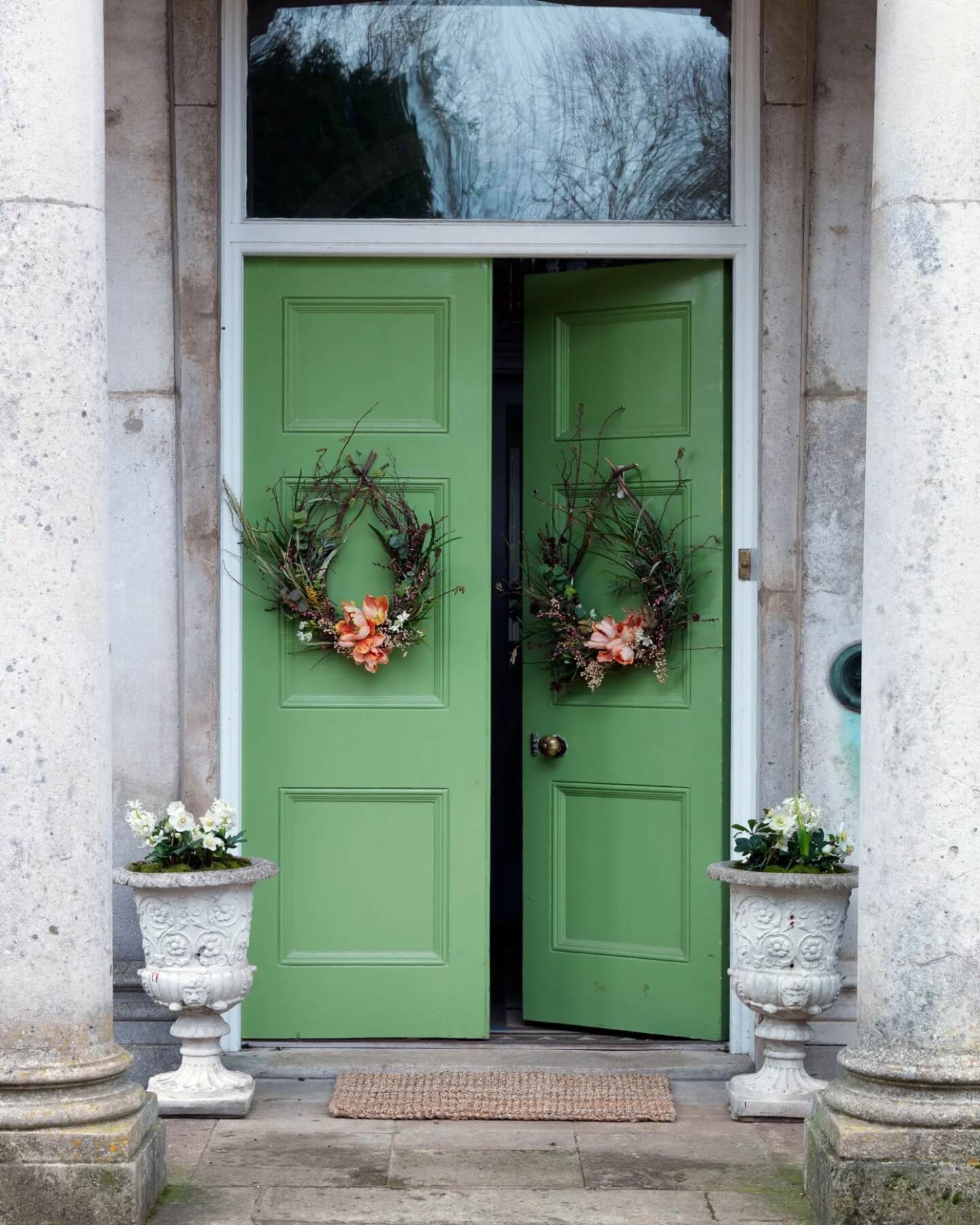 Double Green Doors With Natural Branch Wreaths and Coral Flowers