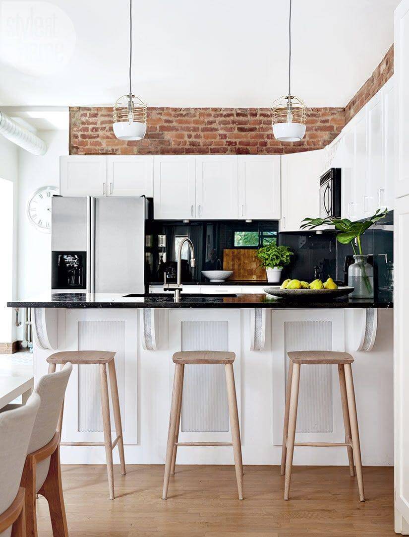 Exposed Brick Adds Rustic Texture Above White Cabinets