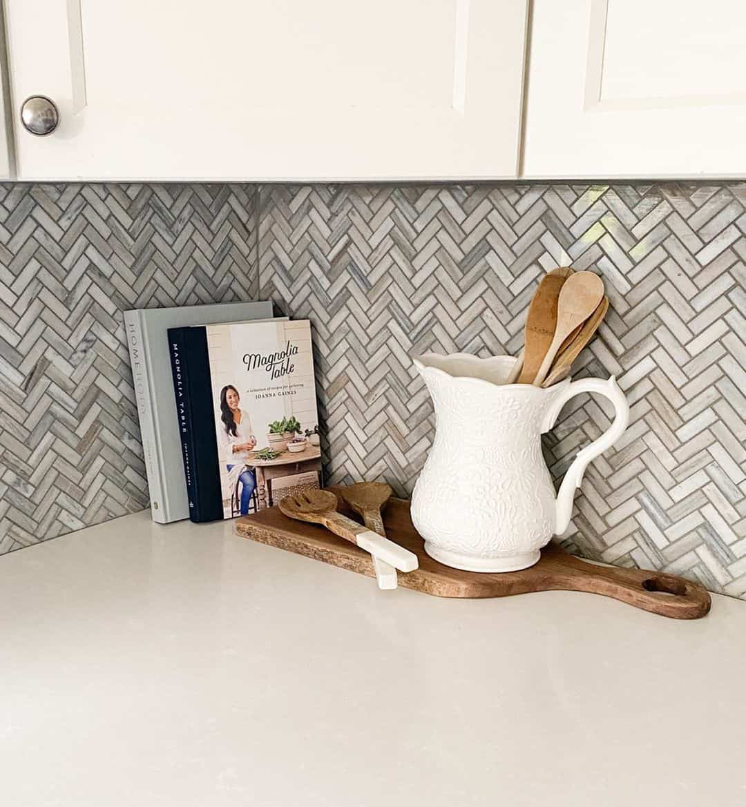 Herringbone Tile Backsplash Adds Subtle Movement Behind Kitchenware