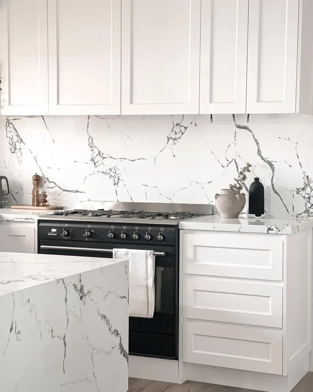 Seamless Flow with a Marble-Look Slab Backsplash