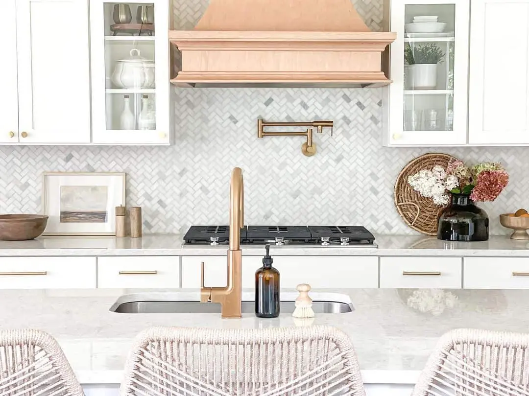 Brass Pot Filler Faucet Adds Warmth to Marble Herringbone
