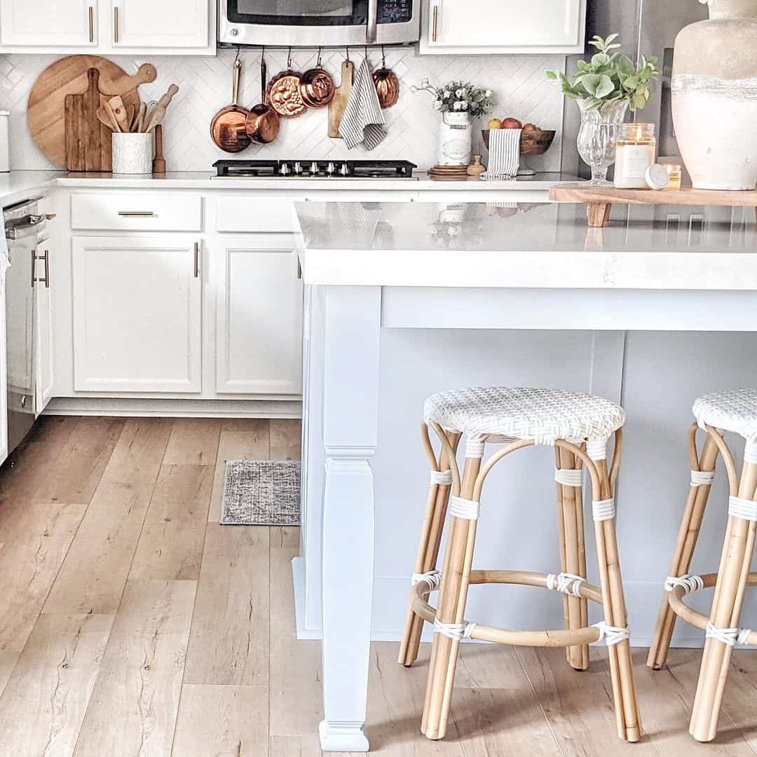 Copper Pots Add Warm Tones to White Herringbone Backsplash