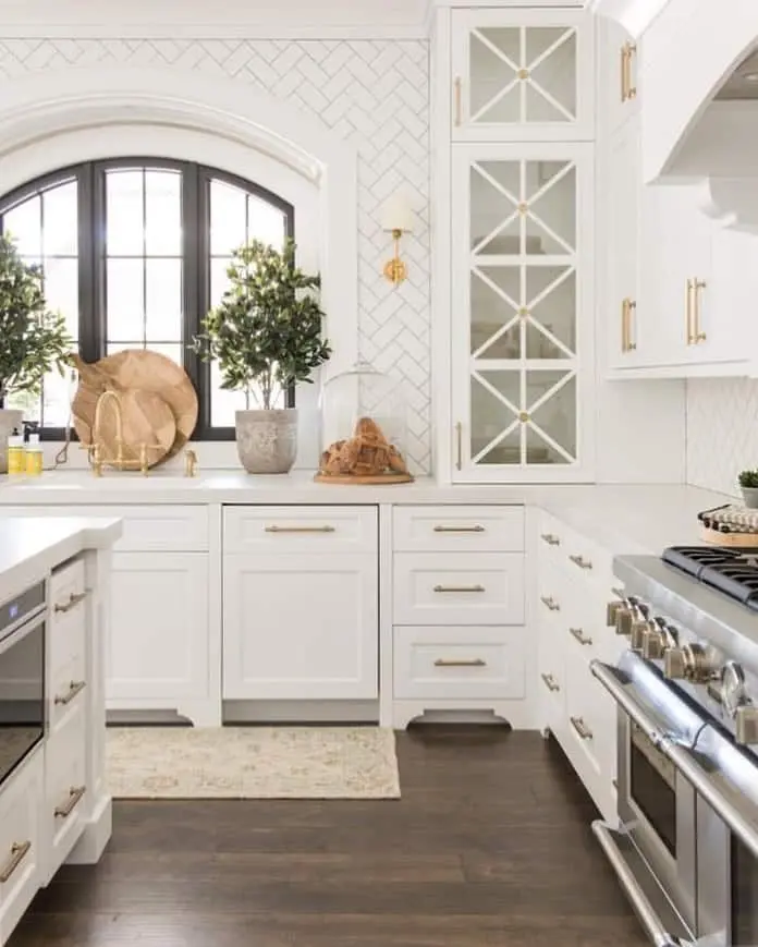 Geometric Glass Fronts Add Detail to White Cabinetry