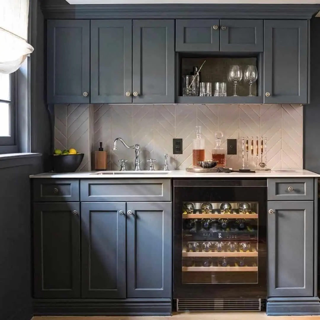 Light Herringbone Backsplash Behind a Sleek Wet Bar