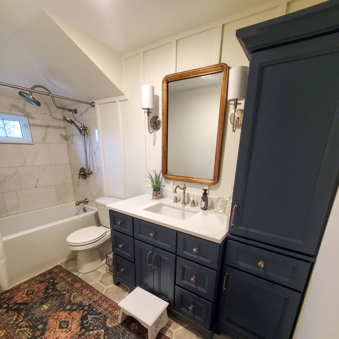 Anchor Your Space With Navy Cabinetry and a Wood Mirror