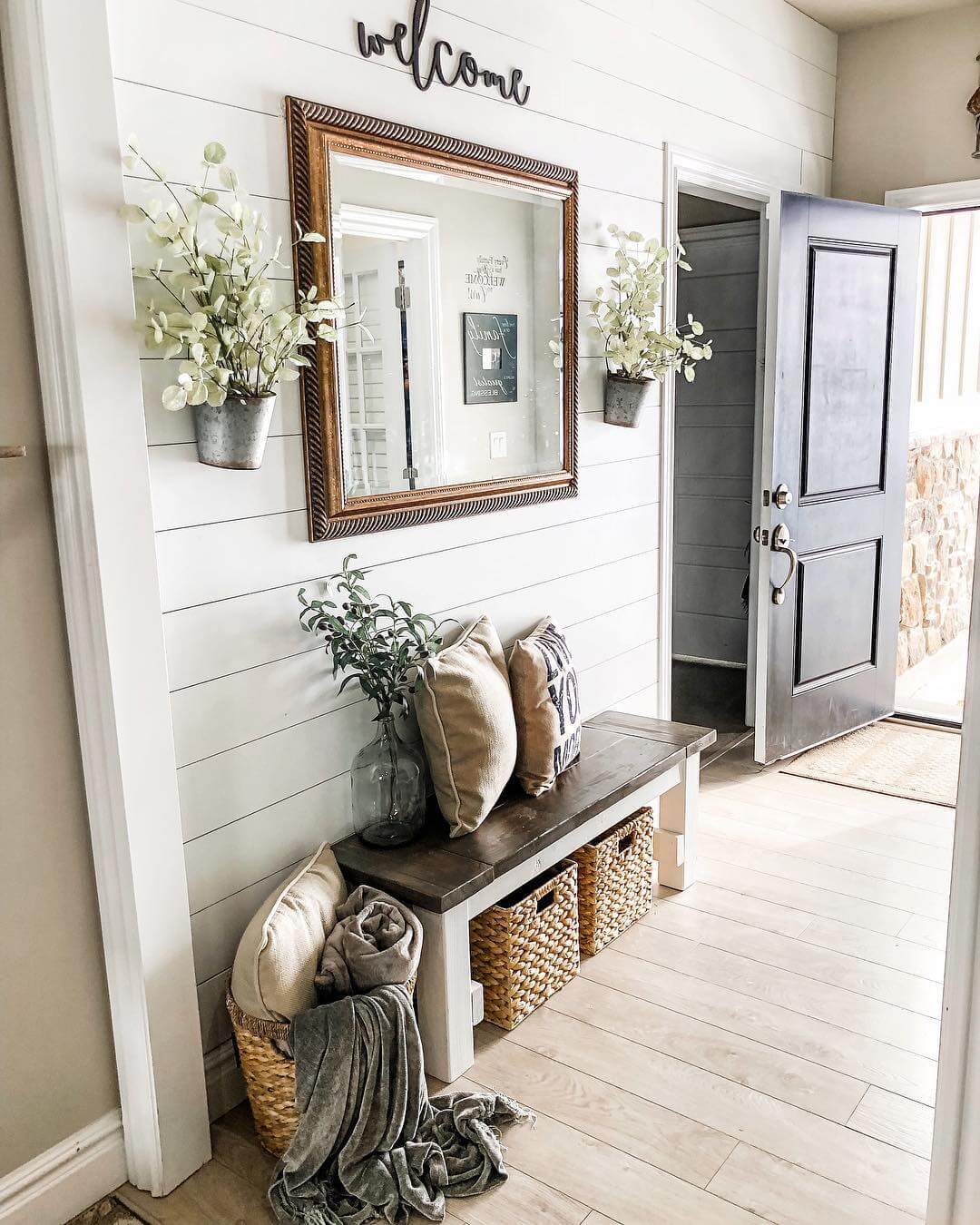 Galvanized Buckets Hold Faux Greenery on Shiplap Walls
