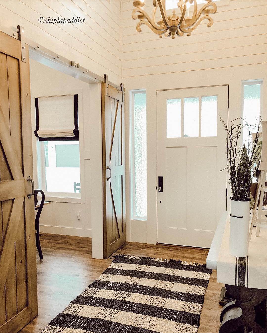 Rustic Barn Doors Slide Open to Reveal Entryway