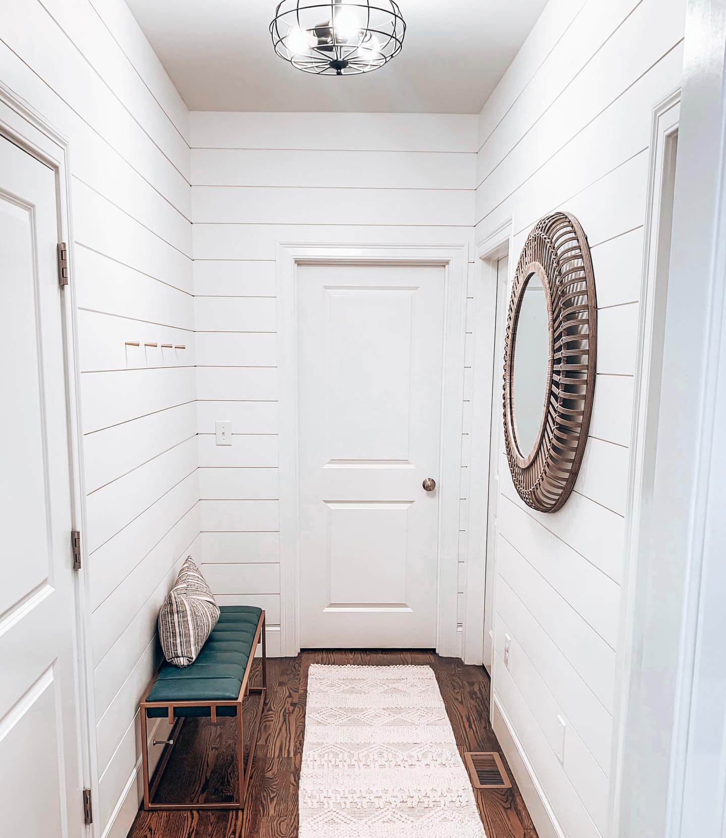 Soften Shiplap with a Round Rattan Mirror