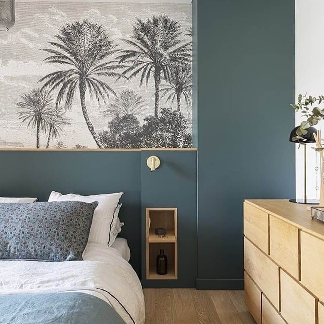 Deep Teal Walls Create a Moody Tropical Bedroom