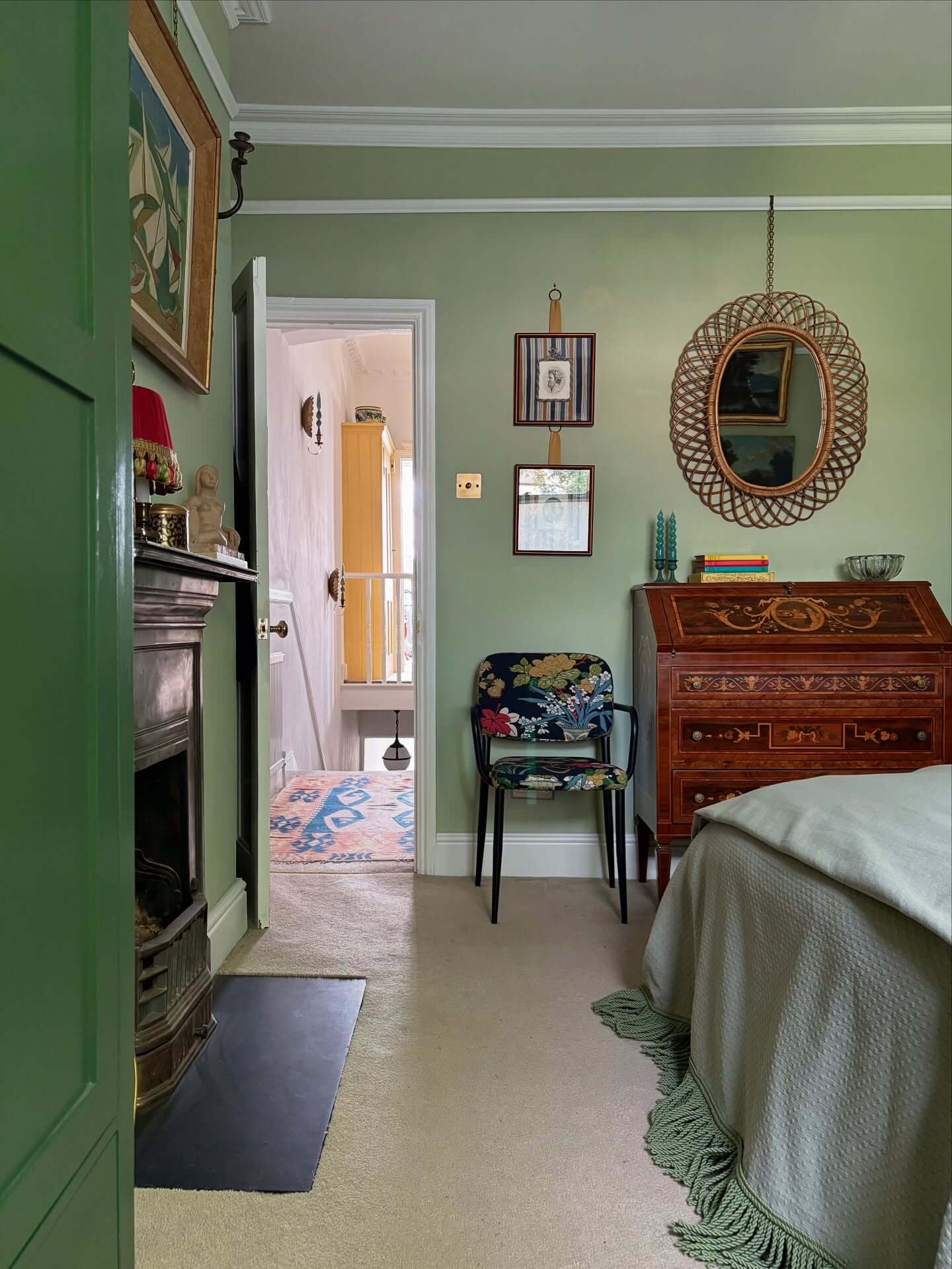 Floral Upholstery Pops Against Pale Green Walls