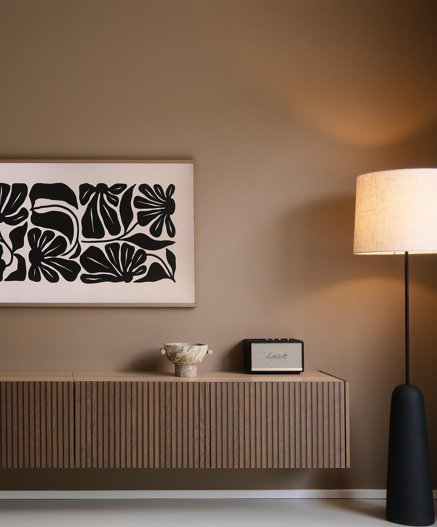 Bold Floral Art Contrasts Warm Neutral Walls