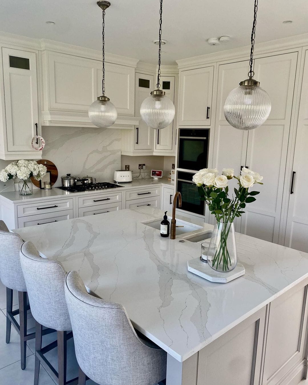 Kitchen Island with Waterfall Countertops and Subtle Veining