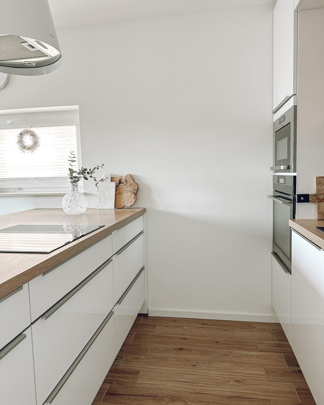 Sleek White Drawers with Integrated Silver Bar Pulls for a Handleless Look