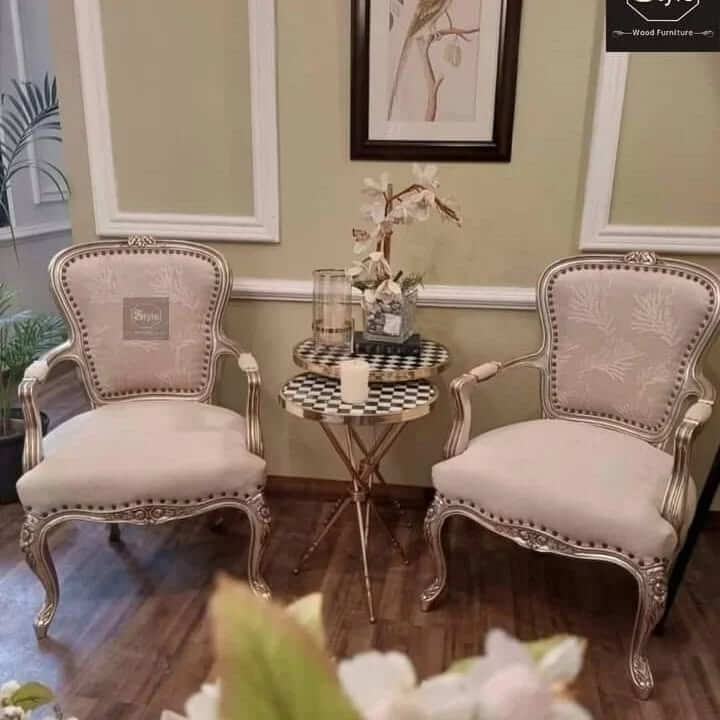 Ornate Armchairs Framing a Tiered Side Table