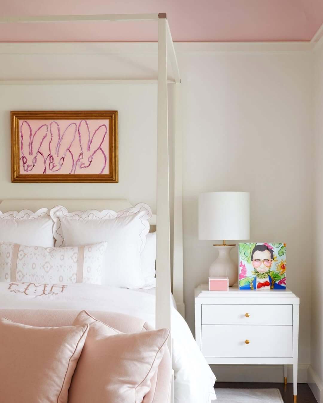 White Drawer Nightstand With Colorful Art and Pink Box