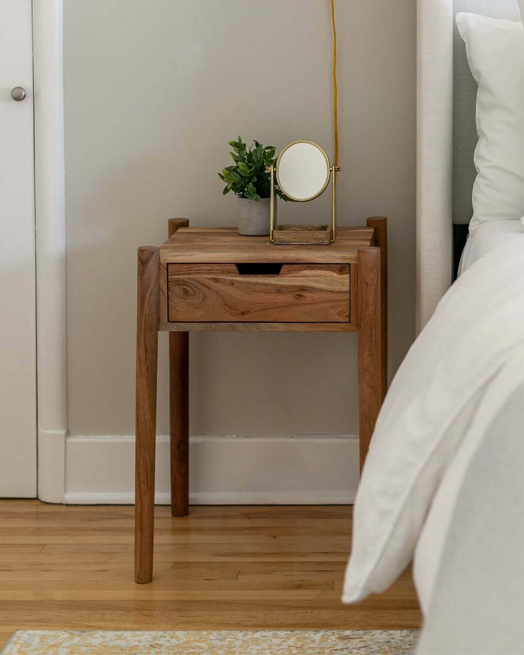 Warm Wood Nightstand With Slotted Drawer Pull