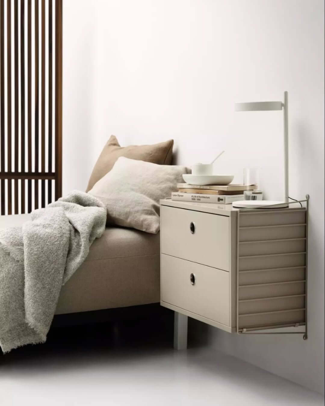 Wall-Mounted Nightstand With Integrated Magazine Rack