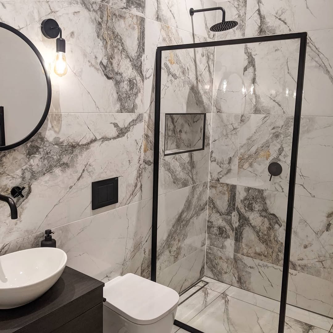 Ground a Marble Shower with Black Frame Details