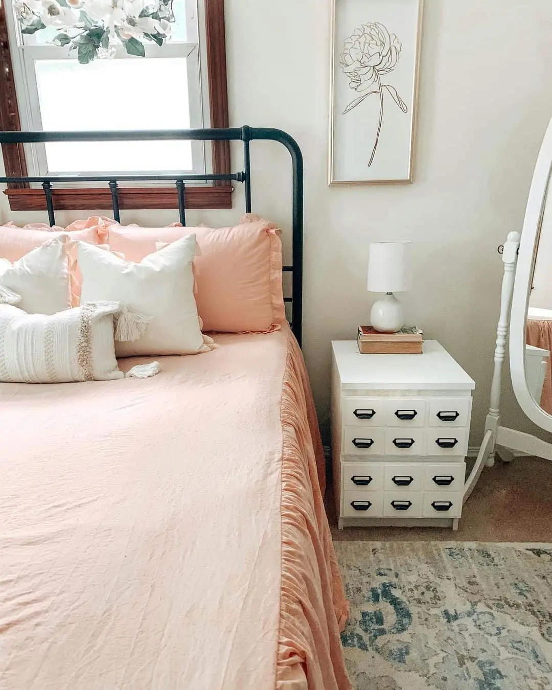 Contrast Soft Bedding with a Black Metal Bed Frame