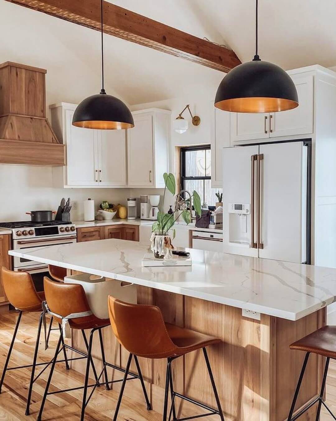 Warm Tan Leather Stools Complement Marble Countertop