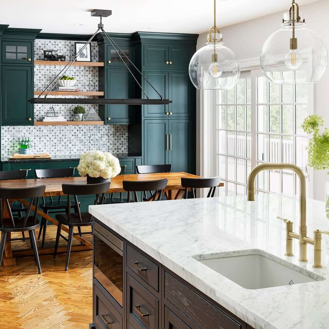 Deep Teal Cabinets Frame a Patterned Tile Backsplash