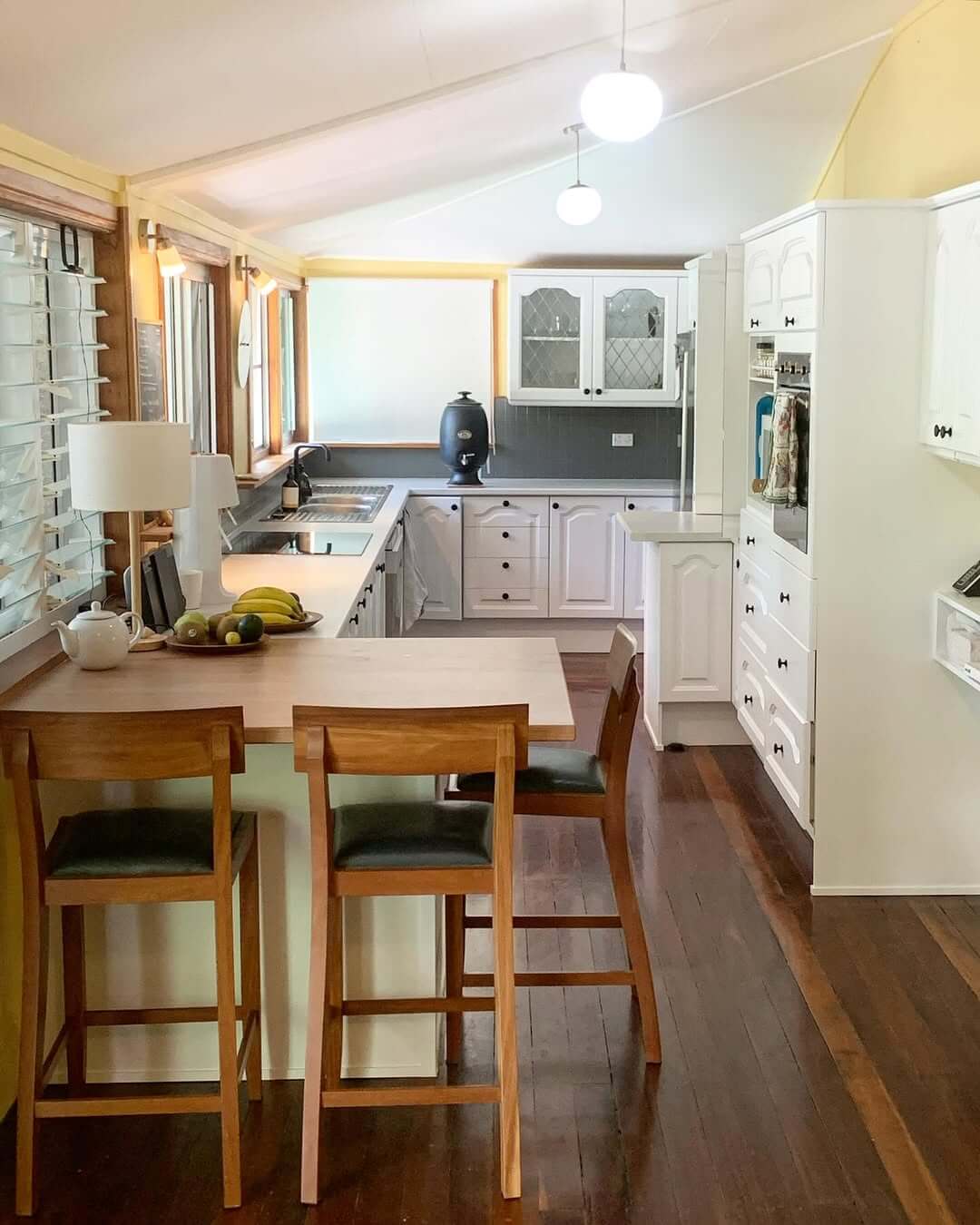 Wooden Saddle Stools Define Breakfast Bar Seating