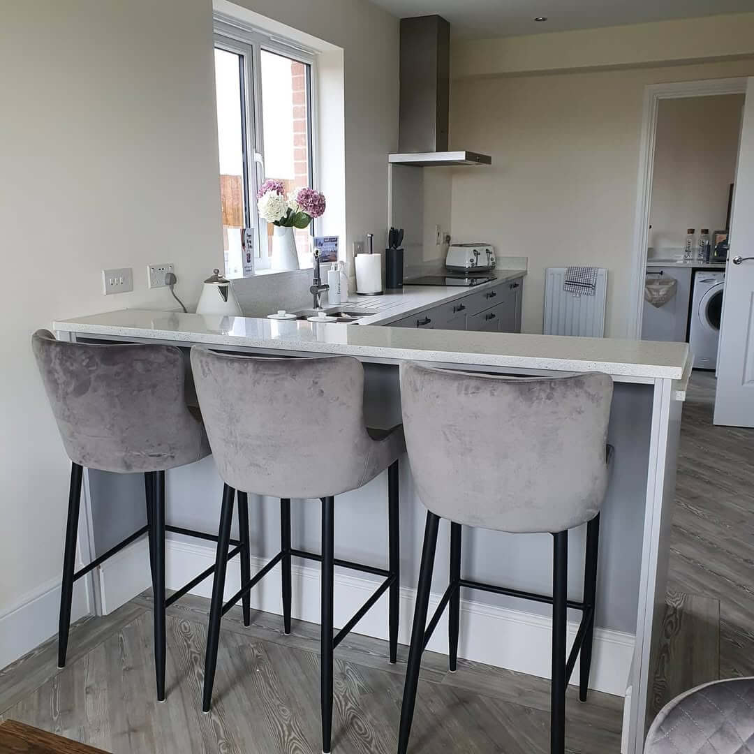Plush Grey Bar Stools Soften a Sleek Breakfast Bar