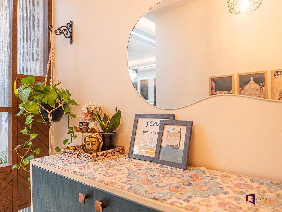 Framed Art and Buddha Head Create a Serene Shelf Vignette