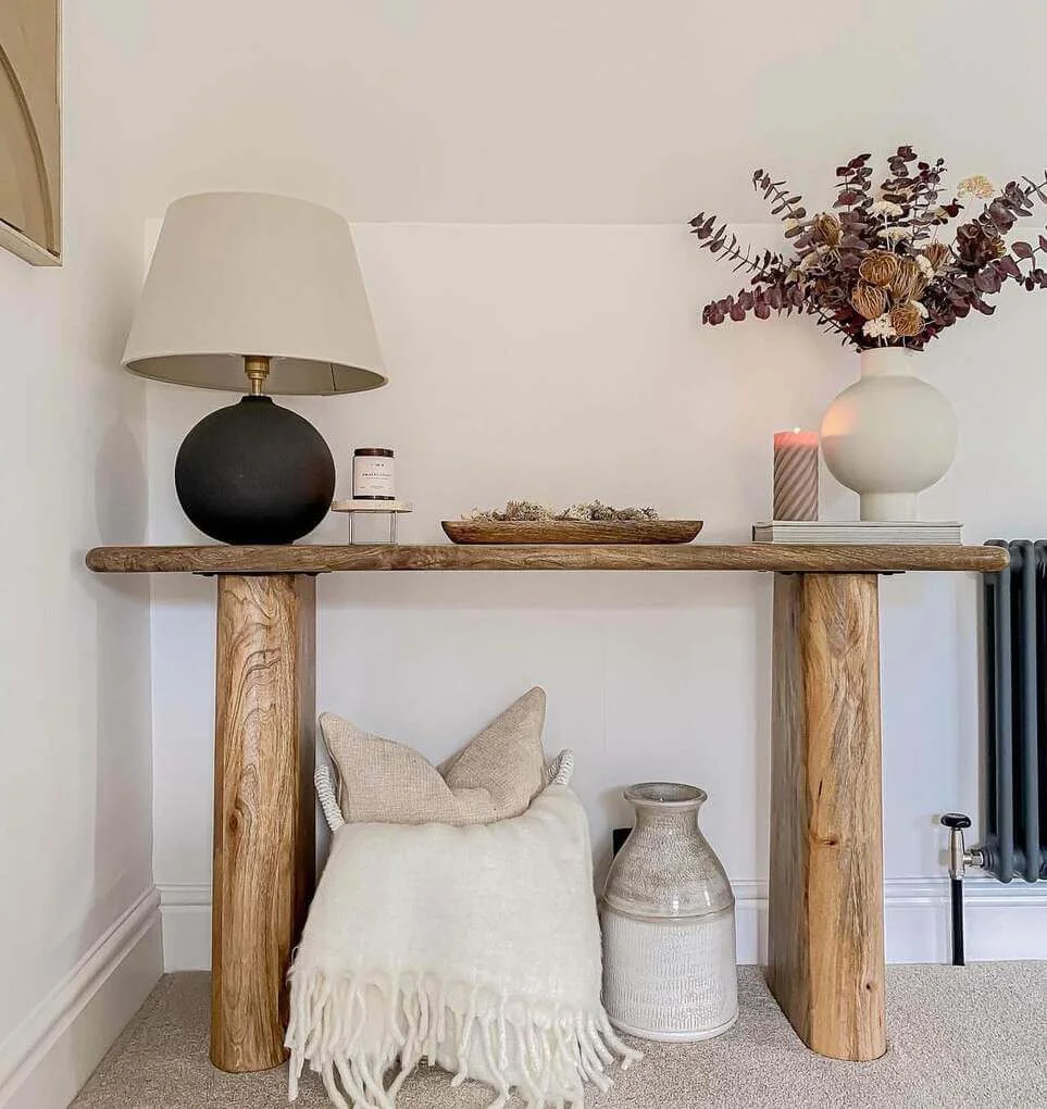 Spherical Lamp and Textured Vase Create a Moody Vignette