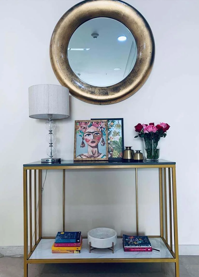 Layered Artwork and Brass Accents for Personality
