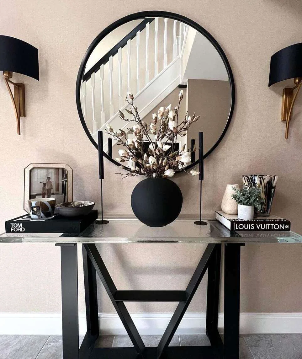 Round Black Vase Anchors a Dramatic Floral Display