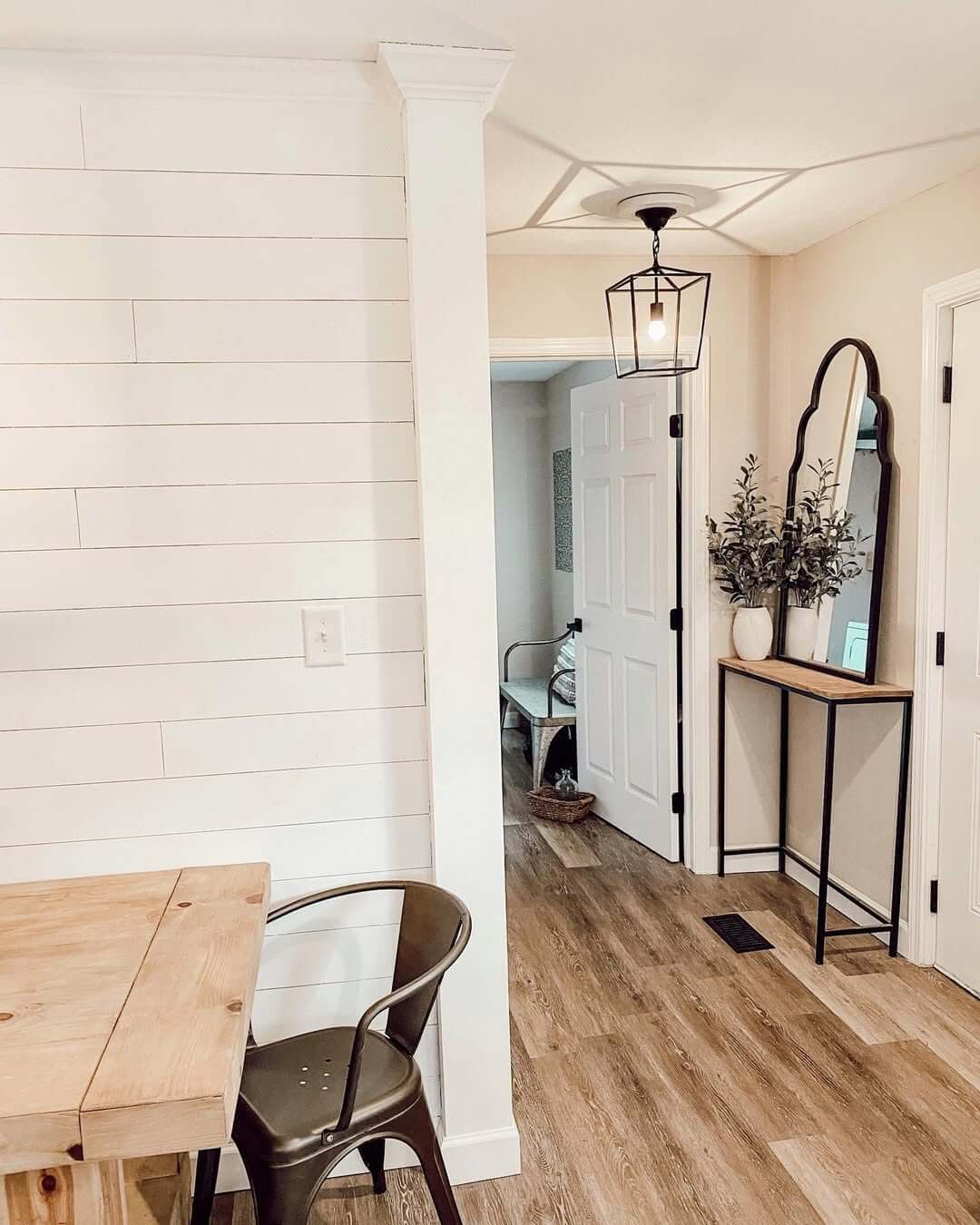 Tall Arched Mirror Adds Dramatic Flair to Narrow Hallway