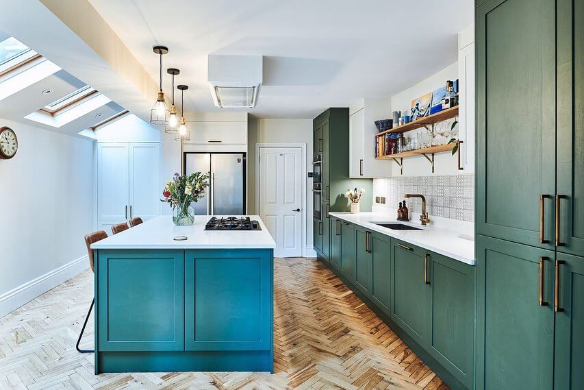 Deep Teal Island Pairs With Green Cabinets for Bold Color