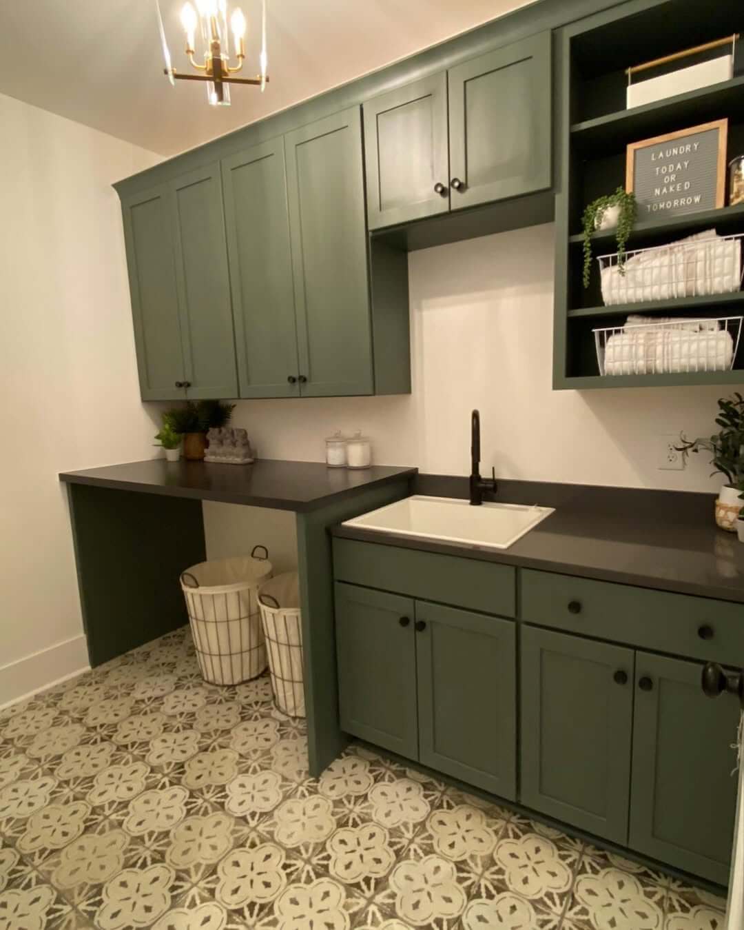 Deep Green Cabinets Frame a Built-In Countertop Desk