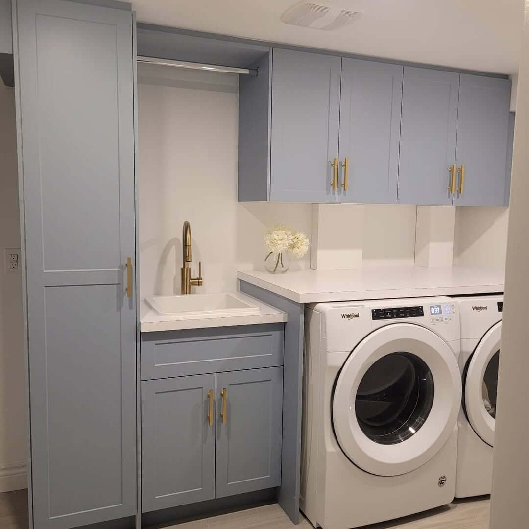 Light Blue Cabinets With Sleek Gold Bar Pulls