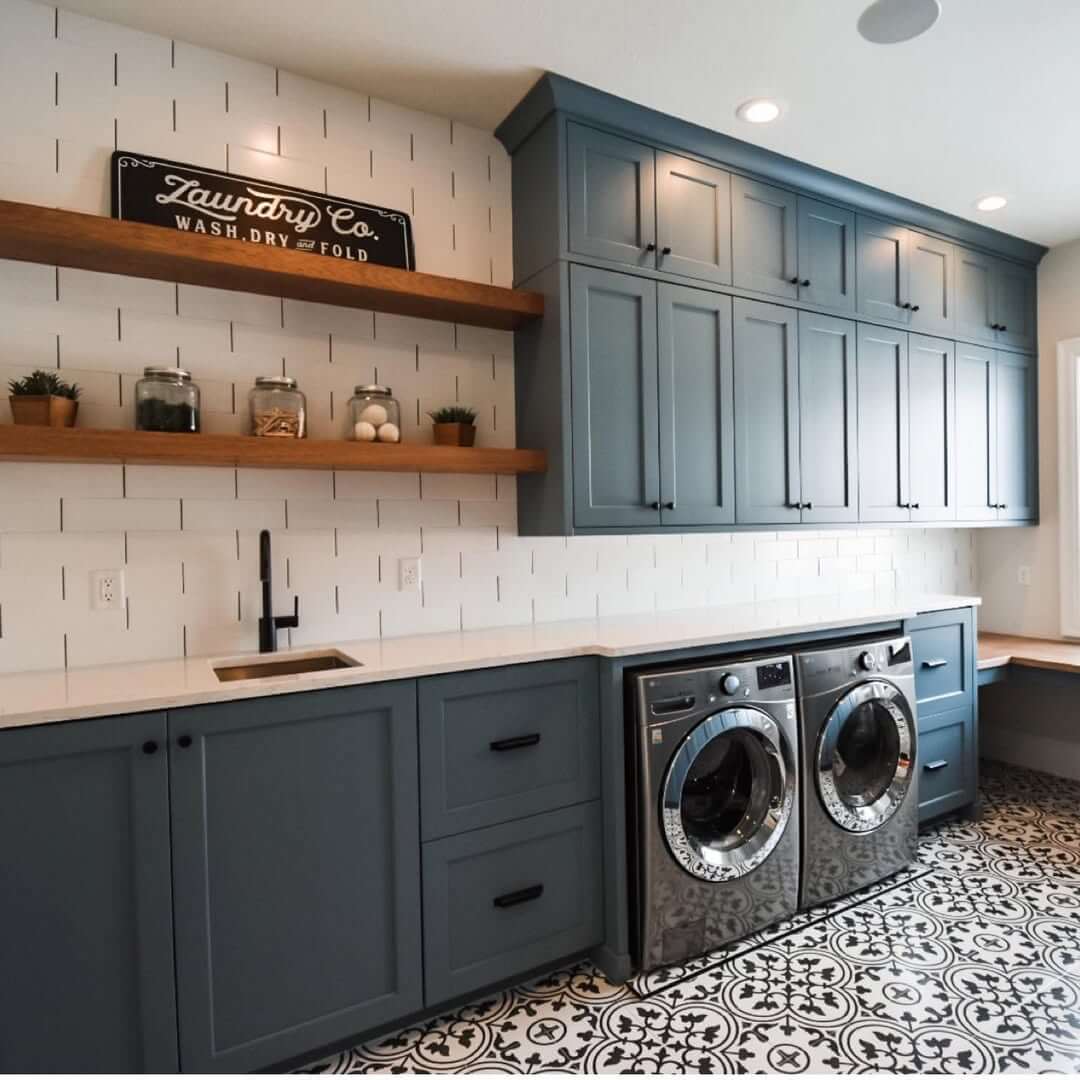 Tall Blue Cabinets Offer Ample Storage Above Machines