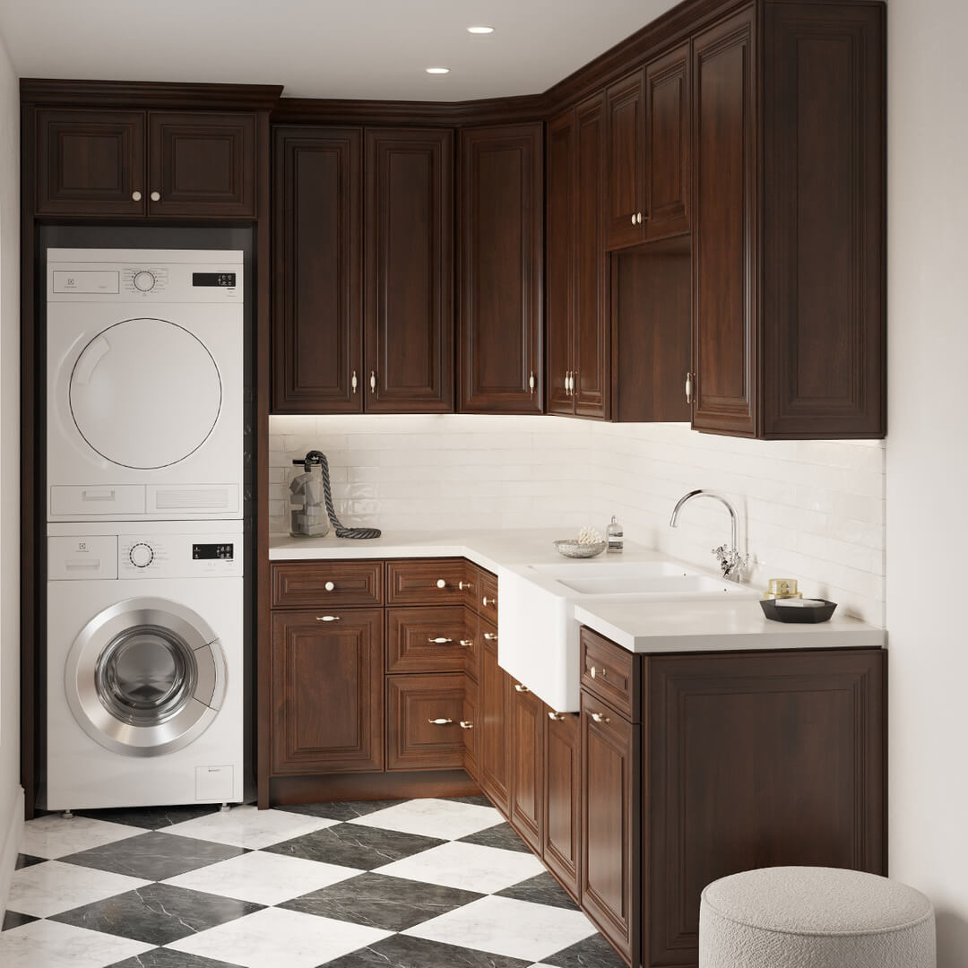 Dark Wood Cabinets Frame a Farmhouse Sink and Stacked Washer/Dryer