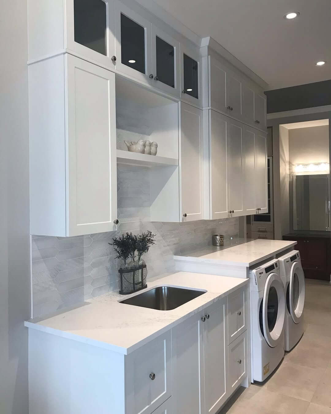 Glass-Fronted Upper Cabinets Keep Items Visible Yet Dust-Free